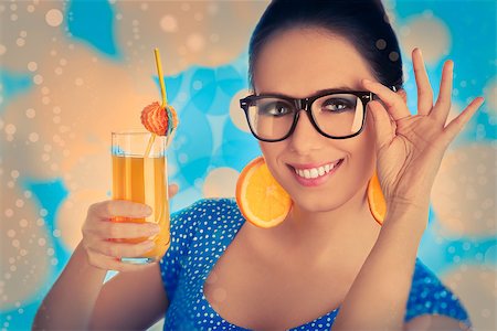 pop art of holding - Young woman with orange slice earrings and glasses holds a glass of  orange juice, vintage portrait Stock Photo - Budget Royalty-Free & Subscription, Code: 400-07549501