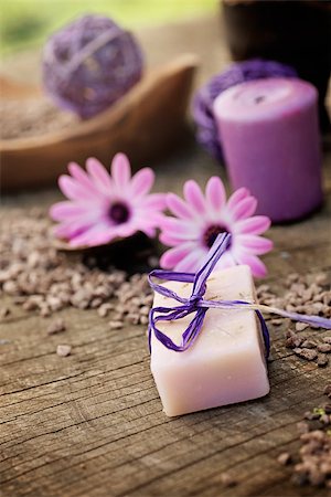 simsearch:400-05902613,k - Spa and wellness setting with natural soap, candles and towel. Violet dayspa nature set dayspa nature set Foto de stock - Royalty-Free Super Valor e Assinatura, Número: 400-07549604