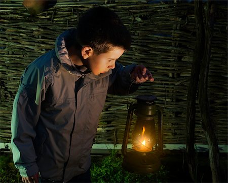 dark people running - Child walk in the darkness with gas lantern Stock Photo - Budget Royalty-Free & Subscription, Code: 400-07549981