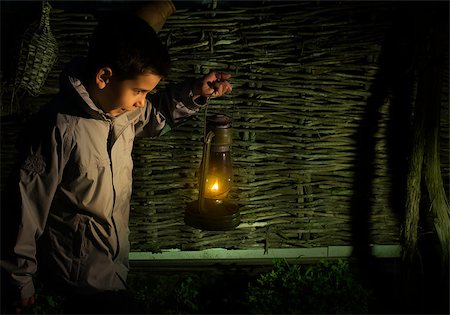 dark people running - Child walk in the darkness with gas lantern Stock Photo - Budget Royalty-Free & Subscription, Code: 400-07549982