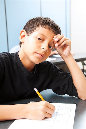 ethnic teen angst - Teen boy worried about taking a standardized test. Stock Photo - Budget Royalty-Free & Subscription, Code: 400-07554293