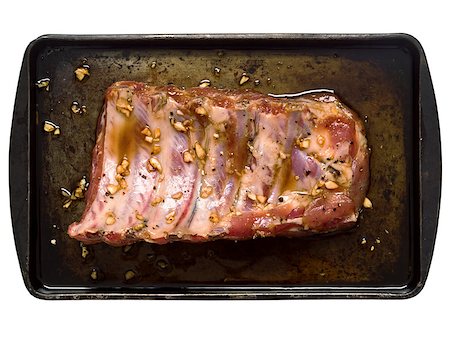 close up of a slab of rustic raw uncooked marinated pork ribs Foto de stock - Super Valor sin royalties y Suscripción, Código: 400-07554745