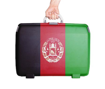 simsearch:400-04724192,k - Used plastic suitcase with stains and scratches, printed with flag, Afghanistan Stock Photo - Budget Royalty-Free & Subscription, Code: 400-07555077