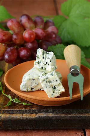 simsearch:400-05682309,k - pieces of blue cheese with red grapes on a wooden table Stock Photo - Budget Royalty-Free & Subscription, Code: 400-07555351