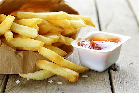 simsearch:400-08338439,k - Traditional potatoes French fries with salt on wooden background Stock Photo - Budget Royalty-Free & Subscription, Code: 400-07555967