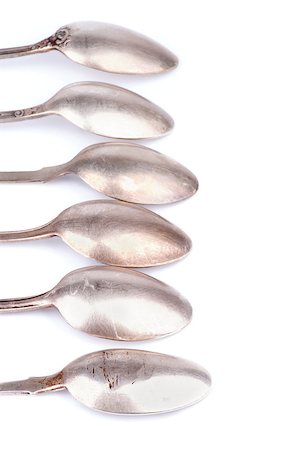 simsearch:628-02198065,k - Frame of Old Silver Spoons In a Row isolated on white background Stock Photo - Budget Royalty-Free & Subscription, Code: 400-07556535