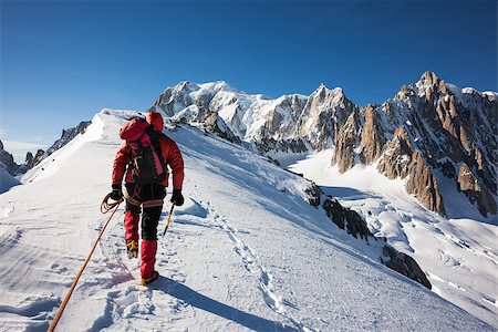 Mountaneer climbs a snowy ridge in Mont Blanc, France. Enterprise, diligence, team work: mountaneering concepts. Stock Photo - Budget Royalty-Free & Subscription, Code: 400-07557539