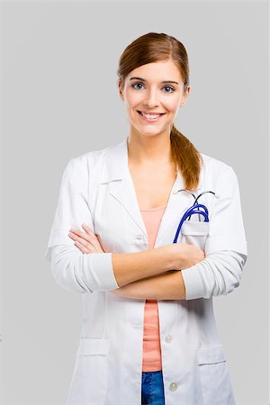 Beautiful and attractive female doctor, isolated over a white background Stock Photo - Budget Royalty-Free & Subscription, Code: 400-07558030