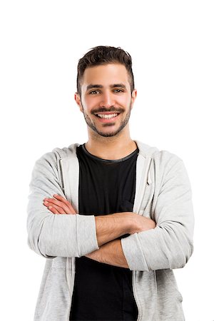 simsearch:400-05912369,k - Beautiful and happy man smiling with hands folded Fotografie stock - Microstock e Abbonamento, Codice: 400-07558125