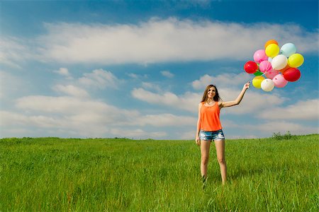 simsearch:400-06077546,k - Young beautiful woman with colorful balloons on a green meadow Stockbilder - Microstock & Abonnement, Bildnummer: 400-07558138