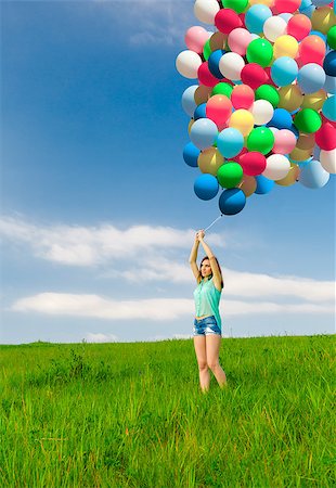 simsearch:400-06077546,k - Young beautiful woman with colorful balloons on a green meadow Stockbilder - Microstock & Abonnement, Bildnummer: 400-07558144