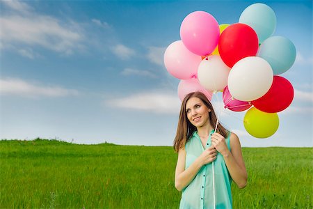 simsearch:400-06077546,k - Young beautiful woman with colorful balloons on a green meadow Stockbilder - Microstock & Abonnement, Bildnummer: 400-07558146