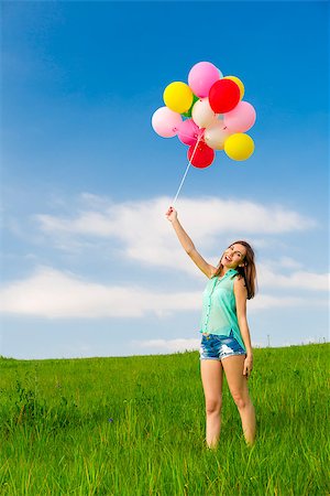 simsearch:400-06077546,k - Young beautiful woman with colorful balloons on a green meadow Stockbilder - Microstock & Abonnement, Bildnummer: 400-07558148