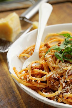 traditional pasta with tomato sauce spaghetti bolognese with parmesan Stock Photo - Budget Royalty-Free & Subscription, Code: 400-07558340