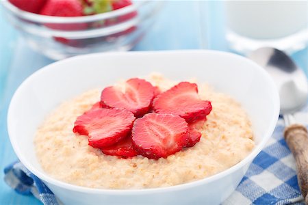 porridge and berries - Healthy homemade oatmeal with strawberries for breakfast Stock Photo - Budget Royalty-Free & Subscription, Code: 400-07558528