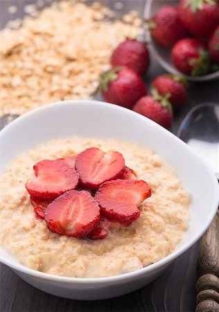porridge and berries - Healthy homemade oatmeal with strawberries for breakfast Stock Photo - Budget Royalty-Free & Subscription, Code: 400-07558529