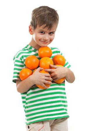 simsearch:400-04979626,k - Boy holding oranges isolated on white background Foto de stock - Super Valor sin royalties y Suscripción, Código: 400-07550513
