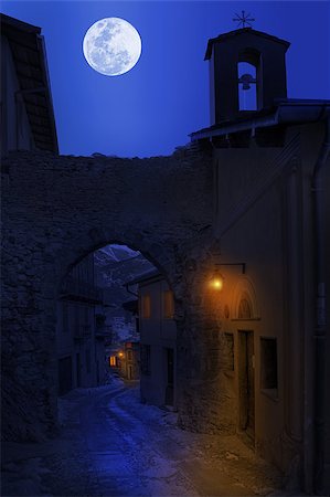 Night view of narrow street between old houses under the sky with full moon in town of Tende, France. Stock Photo - Budget Royalty-Free & Subscription, Code: 400-07550770