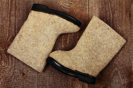 Russian traditional winter felt boot valenki on wooden background. Stock photo Stock Photo - Budget Royalty-Free & Subscription, Code: 400-07551528