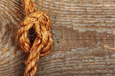 simsearch:400-06106317,k - Close up of rope knot on wooden background. Stock photo Photographie de stock - Aubaine LD & Abonnement, Code: 400-07551531