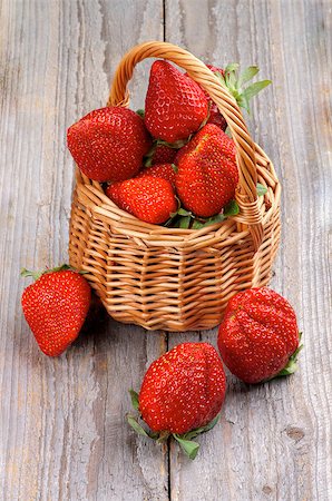 simsearch:400-08020671,k - Big Fresh Ripe Strawberries in Wicker Basket isolated on Wooden background Stock Photo - Budget Royalty-Free & Subscription, Code: 400-07553182