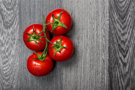 Top view of fresh tomatoes on gray table Stock Photo - Budget Royalty-Free & Subscription, Code: 400-07553502