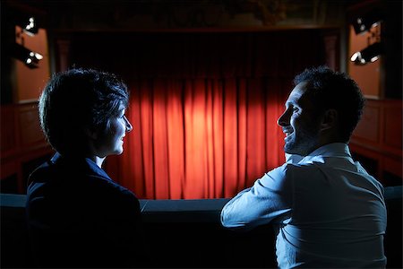 diego_cervo (artist) - Arts and entertainment in theatre, with man and woman looking at stage with red curtains Fotografie stock - Microstock e Abbonamento, Codice: 400-07553615