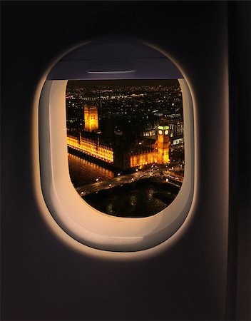 Approaching destination London UK destination, jet plane window night sky view Foto de stock - Super Valor sin royalties y Suscripción, Código: 400-07568253