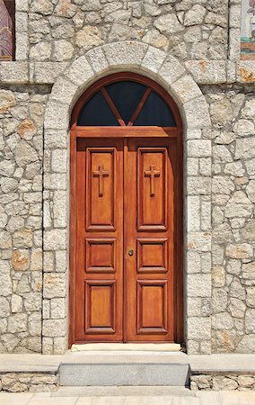 simsearch:400-07090264,k - Stone church facade wooden double doors closed Stock Photo - Budget Royalty-Free & Subscription, Code: 400-07568263