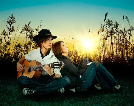 Love story. A young man playing guitar for his girl. Stock Photo - Budget Royalty-Free & Subscription, Code: 400-07568416