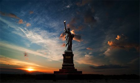 freedom monument - Statue of Liberty on the background of sunrise and cloudy sky Stock Photo - Budget Royalty-Free & Subscription, Code: 400-07569101