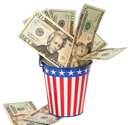 Twenty-dollar bills stuffed into a stars-and-stripes decorated pail. Concept of American money going to the government in taxes. Stock Photo - Budget Royalty-Free & Subscription, Code: 400-07569253