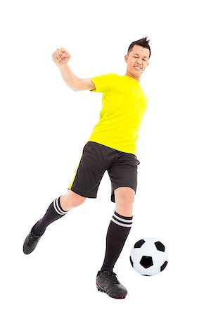 simsearch:400-04325504,k - Soccer player kicking ball Fotografie stock - Microstock e Abbonamento, Codice: 400-07569808