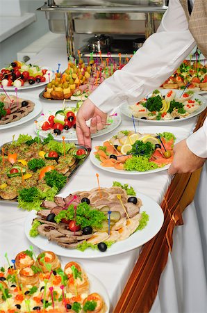 luxury served banquet table with canapés and chafing dishes Stock Photo - Budget Royalty-Free & Subscription, Code: 400-07569960