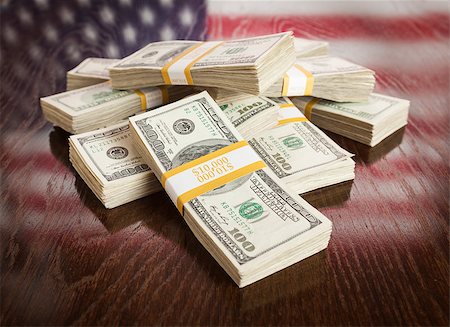 franklin - Thousands of Dollars Pile with Reflection of American Flag on Wooden Table. Stock Photo - Budget Royalty-Free & Subscription, Code: 400-07574812