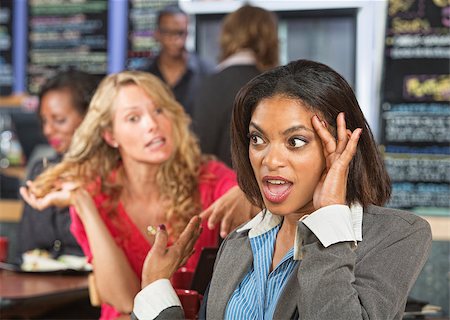 Irritated business woman listening to emotional lady Foto de stock - Super Valor sin royalties y Suscripción, Código: 400-07577387