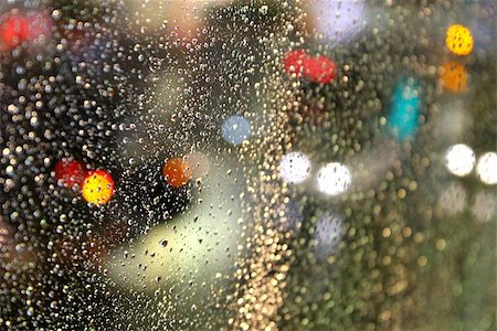 raindrop window - Night time raindrops on a glass window with bokeh lights of the city life in the background. Stock Photo - Budget Royalty-Free & Subscription, Code: 400-07577403