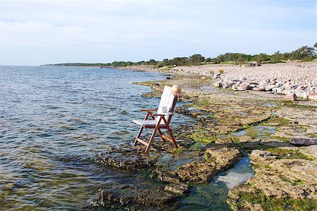 Chair at flat rock coast at the  island  oland  in Sweden Foto de stock - Super Valor sin royalties y Suscripción, Código: 400-07577429