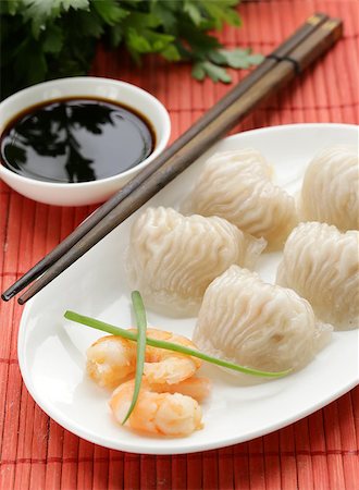 dim sum - Asian steamed meat dumplings dim sum with soy sauce Foto de stock - Super Valor sin royalties y Suscripción, Código: 400-07577476