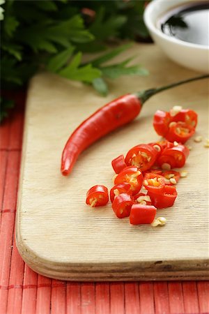 simsearch:400-07211737,k - fresh red chili peppers on a wooden board Photographie de stock - Aubaine LD & Abonnement, Code: 400-07577473