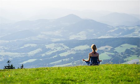 Young woman meditating outdoors Stock Photo - Budget Royalty-Free & Subscription, Code: 400-07577925