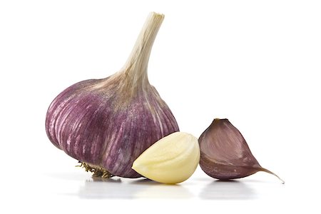 heads of garlic and garlic cloves on a white background Foto de stock - Super Valor sin royalties y Suscripción, Código: 400-07577989