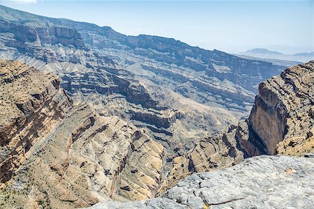simsearch:862-05999703,k - Image of canyon on mountain Jebel Shams in Oman Stock Photo - Budget Royalty-Free & Subscription, Code: 400-07578691