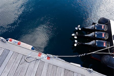 photojope (artist) - Motorboat with three engines out the water in the dock. Fotografie stock - Microstock e Abbonamento, Codice: 400-07579114