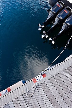 photojope (artist) - Motorboat with three propellers out the water in the dock. Photographie de stock - Aubaine LD & Abonnement, Code: 400-07579115