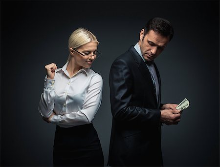 simsearch:400-04610806,k - Businessman and businesswoman with money Stock Photo - Budget Royalty-Free & Subscription, Code: 400-07579159