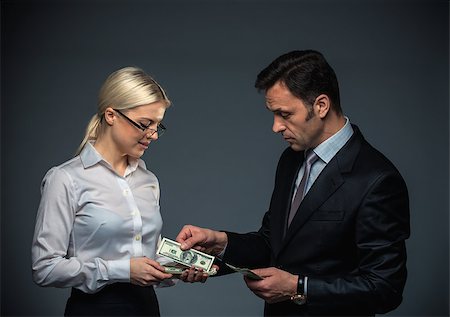 simsearch:400-04610806,k - Businessman and businesswoman with money Stock Photo - Budget Royalty-Free & Subscription, Code: 400-07579165