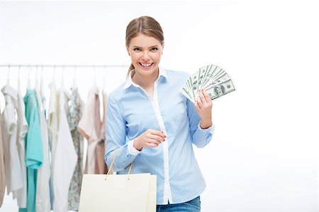 simsearch:400-04107785,k - Woman with money and shopping bags Fotografie stock - Microstock e Abbonamento, Codice: 400-07579239