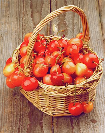 simsearch:400-08020671,k - Sweet Maraschino Cherries in Wicker Basket on Wooden background. Retro Styled Stock Photo - Budget Royalty-Free & Subscription, Code: 400-07579645