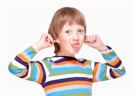 Boy Pulling his Ears and Sticking out Tongue - Isolated on White Stock Photo - Budget Royalty-Free & Subscription, Code: 400-07570295